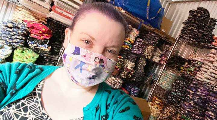 public storage customers wear a masks in her business storage unit